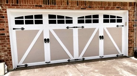After: garage door painted tan with white trim