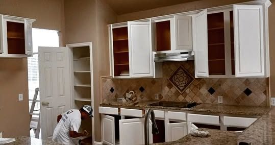 After: kitchen cabinets painted white