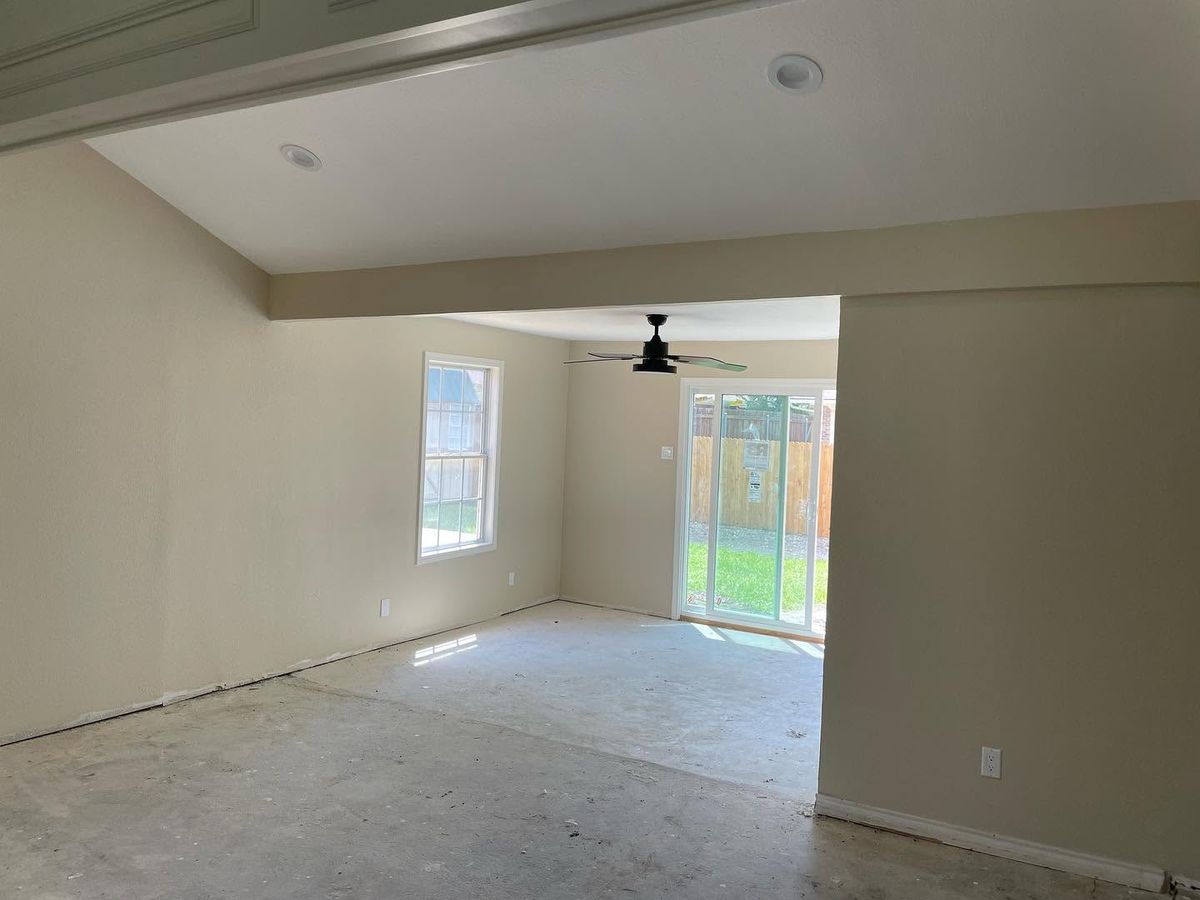 Open living area with freshly painted walls and ceiling